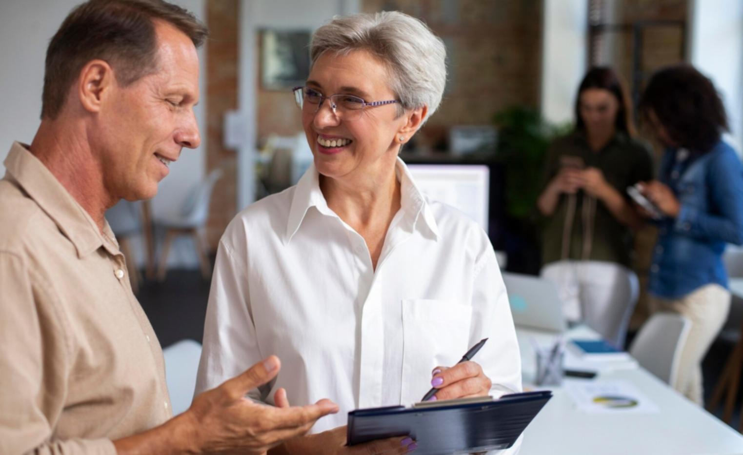 Professional team reviewing financial documents and charts during corporate training session